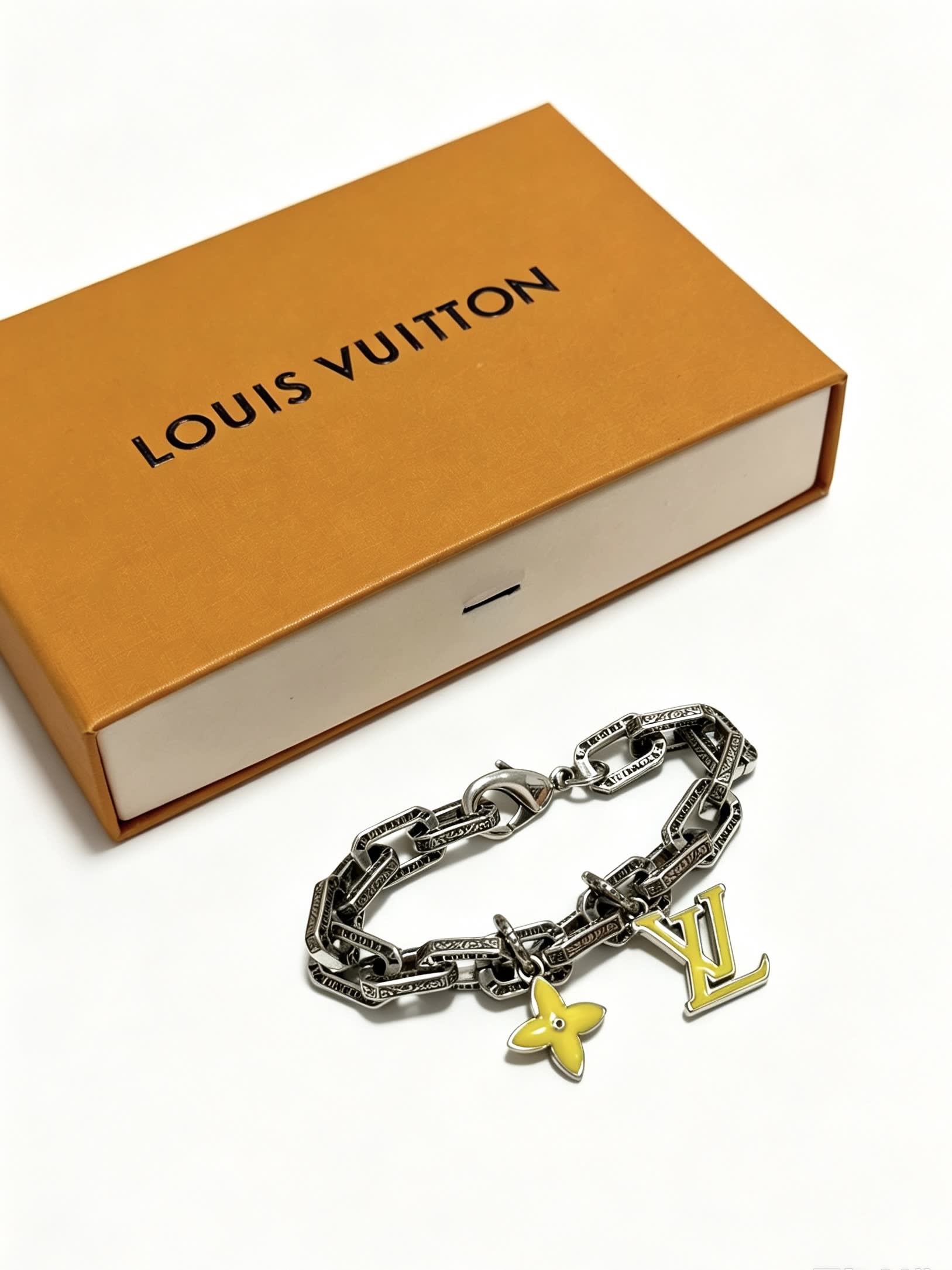 Louis Vuitton Silver Bracelet with LV Logo and Flower Charm